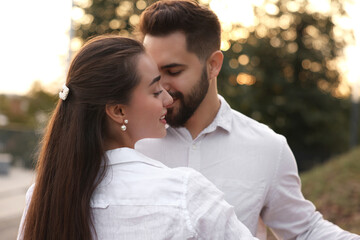 Fototapeta premium Lovely couple dancing together outdoors. Romantic date