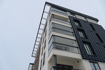 Looking up to modern new apartments building at Pille street during winter time. Tallinn, Estonia, Europe. December 2023