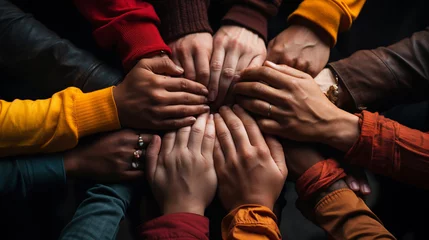 Fotobehang Hands of representatives of different nations together © Daniel