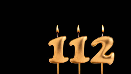 Golden candle 112 with flame - Birthday card on dark luxury background