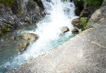 Hiking to the Parcines Waterfalls near Meran in South Tyrol Italy.  - obrazy, fototapety, plakaty