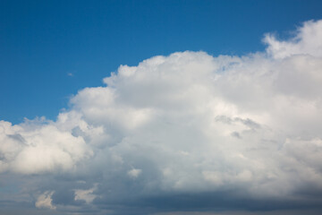Fototapeta na wymiar Big white clouds on the blue sky