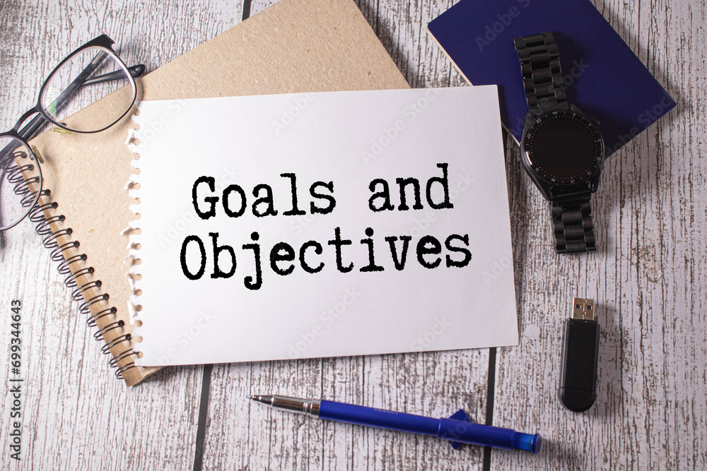 Poster notepad with goals objectives text inscription on notepad on a light background
