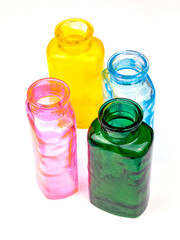 Four transparent glass vases of different colors for interior decoration - 699346656
