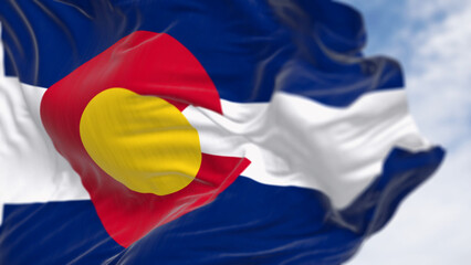Close-up of Colorado state flag waving in the wind on a clear day
