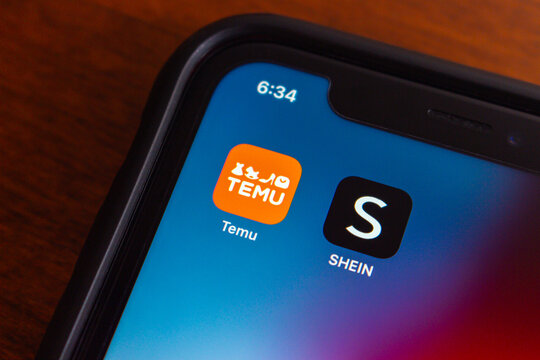 Vancouver, CANADA - Dec 25 2023 : Temu and Shein app icons seen in an iPhone.