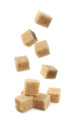 Cubes of brown sugar falling on white background