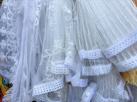 Close-up of white scarves , dupatta stola chunri , stola showing fabric and patterns used by ladies in clothing