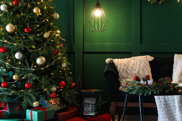 Interior of living room with Christmas tree, gift boxes and sofa