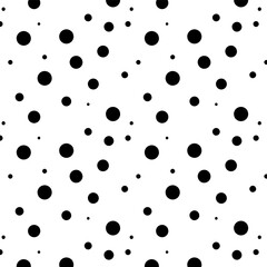 Seamless polka dot pattern.Background of black circles of different sizes on a white background.Vector texture.Memphis style.
