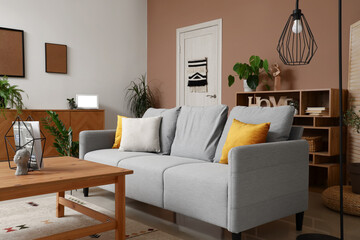Interior of modern living room with grey sofa, standard lamp and wooden coffee table