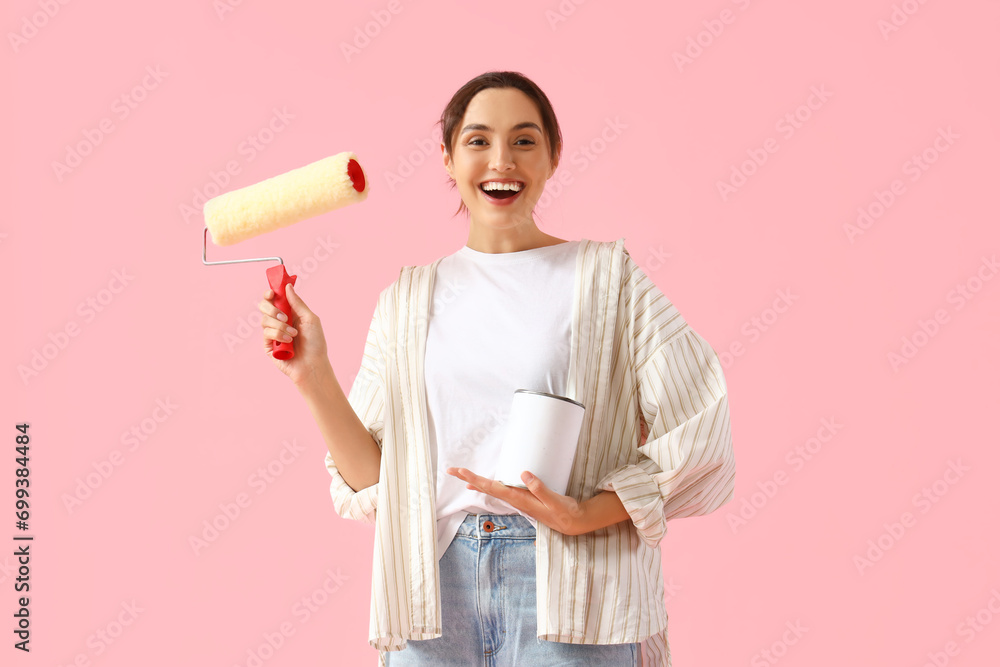 Sticker young woman with paint roller and can on pink background