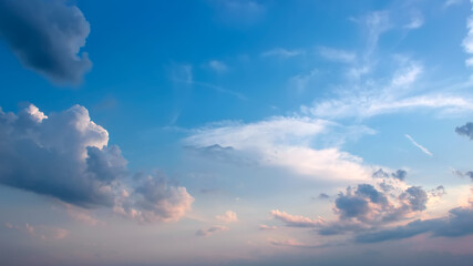 Cloud landscape in delicate pastel shades of pink and blue at sunset, romantic wallpaper, space for...