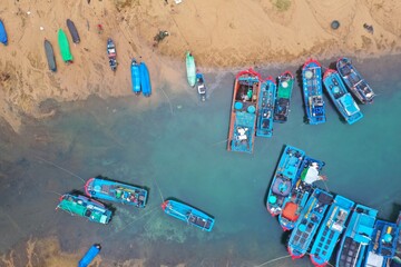 Phu Yen, Vietnam - Dec 26th, 2023 aerial view of Dong Hoa fishing village during windy morning