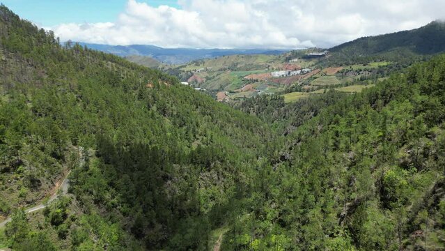 View from Salto Aguas Blancas waterfall towards the lush valley of Constanza in the central mountain range of the Dominican Republic