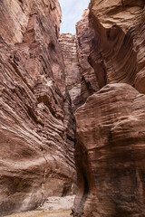High  mountains along edges of gorge at beginning of walking route along  Wadi Numeira gorge in Jordan