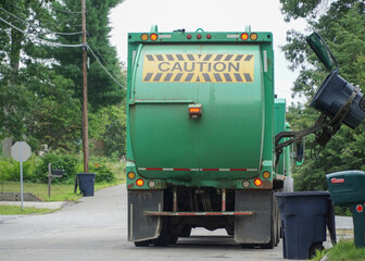 waste collecting truck in the street of residential area
