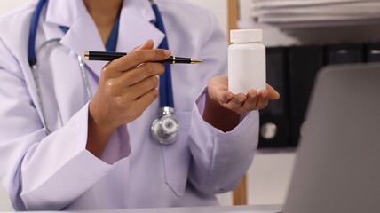 Initial AI illustration of a close-up of a female doctor's hand signing a medical document on a...