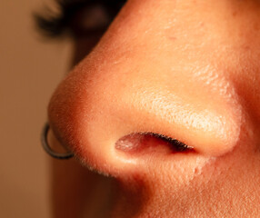 Close-up of a girl's nose. Macro