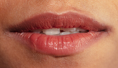 Obraz premium Close-up of a girl's lips and teeth. Macro