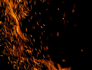 fire flame with sparks on black background.