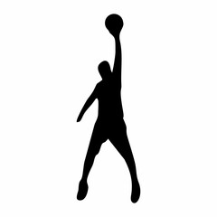 silhouette of person playing basketball