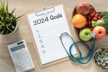 2024 goals, new year resolutions on clipboard note for blank wish list reminder of yearly planner for action on work-life balance, travel  plan and healthy health living aims - obrazy, fototapety, plakaty