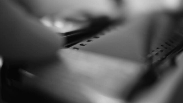 Close up Shot of Loading Film in Camera in Black and White 4K