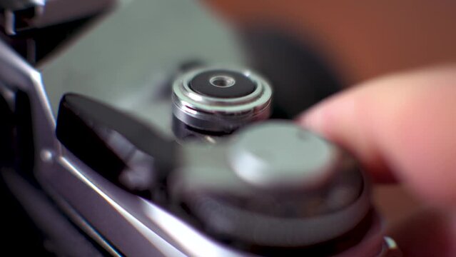 Close up Shot of Old Film SLR Camera Shutter and Winding Know. Cocking the Shutter and Takes Picture