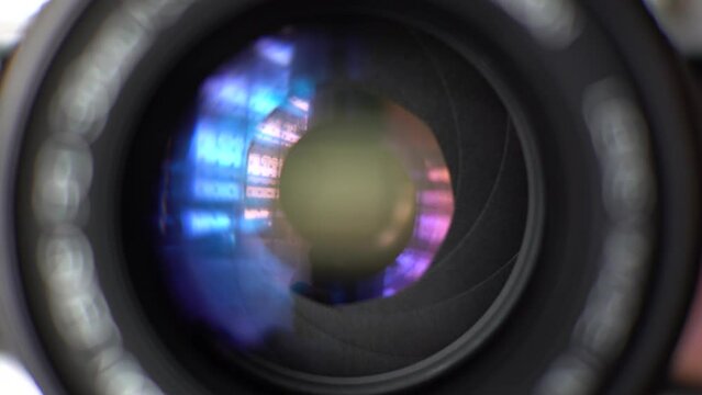 Close up Shot of Camera Lens in 4K. Aperture Open and Close, Blue and Magenta Tint From Glass Coating 