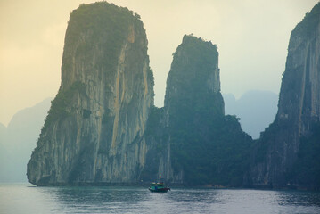 Serene Ha Long Bay: Limestone Karsts and Solitary Boat in Vietnam