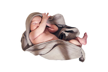 A newborn baby sleeps in a crib with a cocoon and a blanket in the form of a turban on his head,...