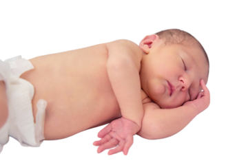 A baby boy sleeps in a cocoon on a cot, isolated on a white background. A newborn baby in a diaper is lying naked on the bed
