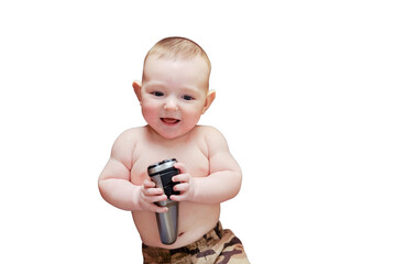 Funny happy baby boy with an electric shaver in his hands. Smiling child holds a razor, isolated on a white background