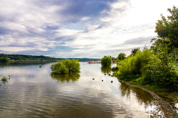 Fototapeta premium View of the Möhnesee and the surrounding landscape in the evening. Nature near Körbecke.
