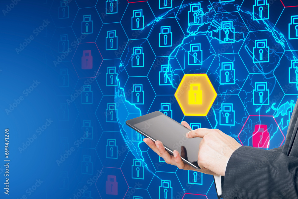Poster Close up of businessman hand using tablet with creative globe with padlock pattern on blue background. Global data safety and protection concept.