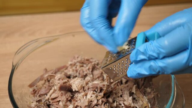 Salt and spices, garlic are added to the meat. Preparation of meat dishes. Slow motion.
