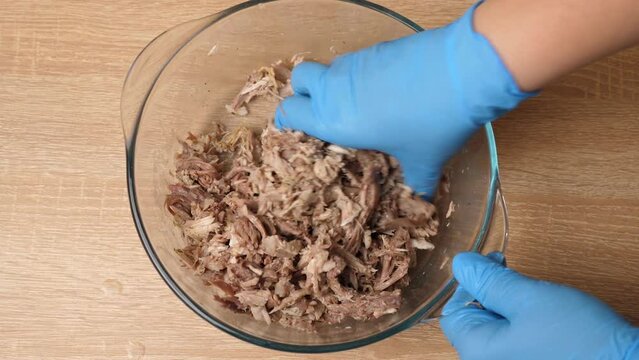 Salt and spices are added to the meat. Preparation of meat dishes. Slow motion.
