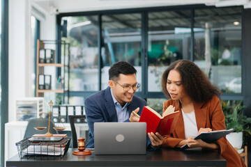business people and lawyers discussing contract papers sitting at the table. Concepts of law, advice, legal services.