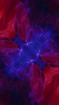 Vertical video. Paint water splash. Surreal fractal. Blue color glitter ink flow motion over mirrored orange flower petals symmetrical kaleidoscope design abstract background.