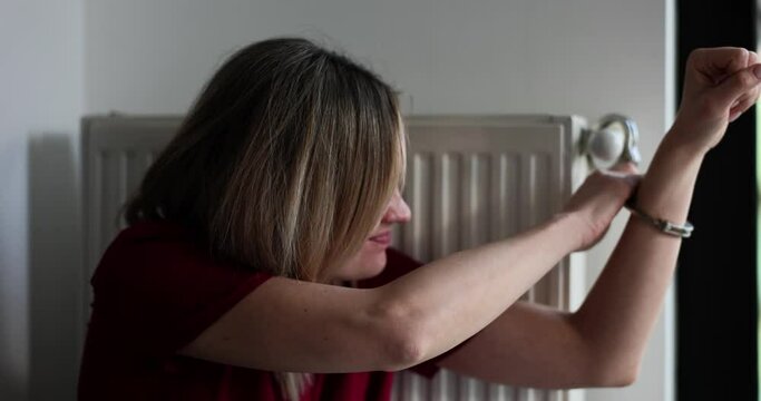 Woman strapped to radiator tries to open handcuff 4k movie slow motion
