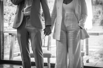 Detail of unrecognizable bride and groom shaking hands at the wedding, marriage portraits