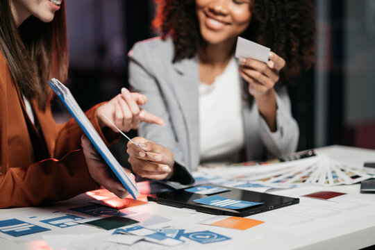 Creative female web designer planning application development for web mobile phone at modern workplace.