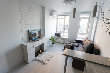 Naklejka na ściany i meble studio in minimalist style, fireplace, sofa