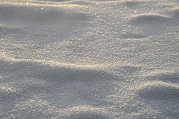 snow with shadows and visible snowflakes, white winter background