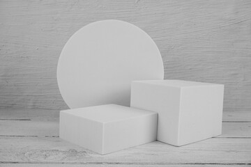 White Podium for product display on wooden background