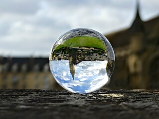 Caen, August 2023 - Visit the magnificent city of Caen, capital of Normandy. View of the city through a lens ball