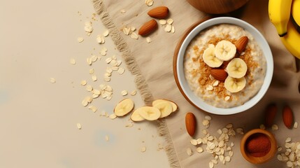 Tasty oatmeal with banana and nuts on table, top view
