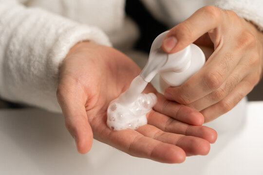 Facial skin care, men's hands with face wash foam