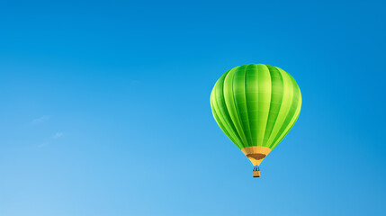 Naklejka premium Colored hot air balloon on a clear blue sky with few clouds 